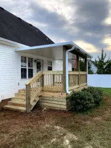 Deck addition added on to house in Murfreesboro, TN with roof and gutter system